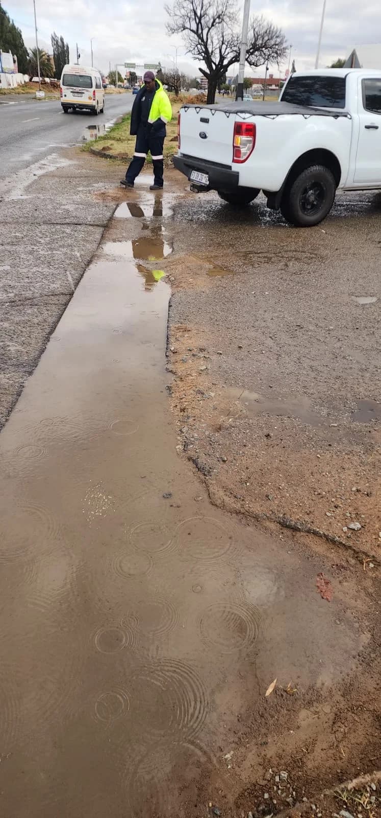 Inspecting a wet roadside work area by Seldariah Trading