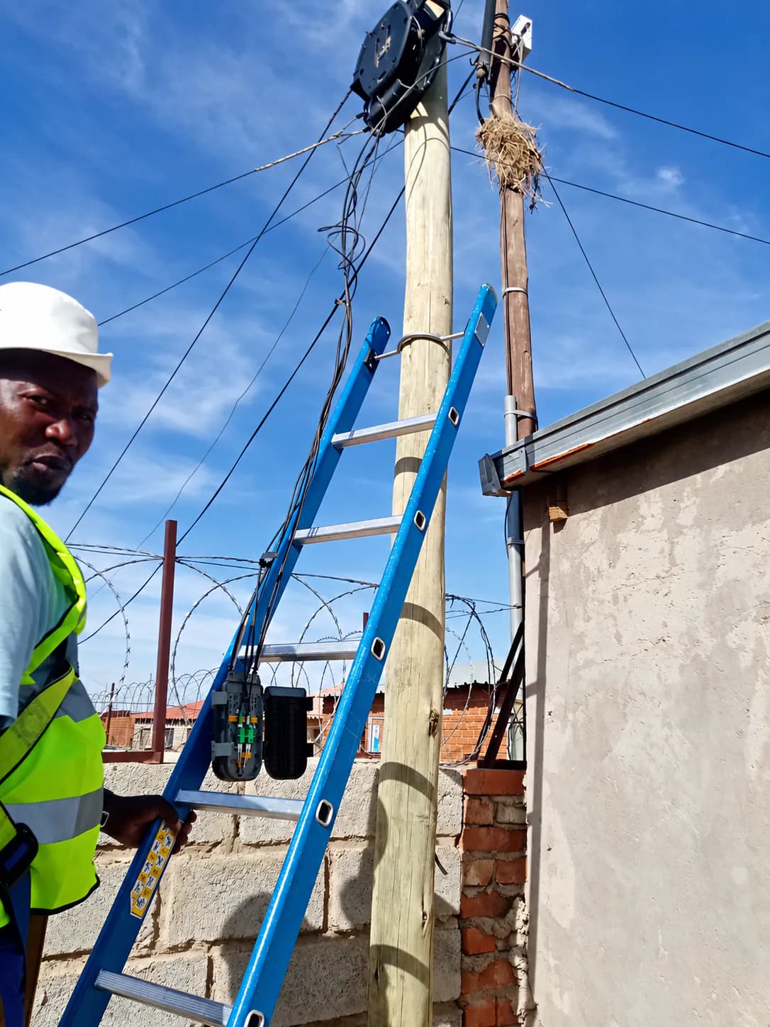 Telecommunications technician working on fibre infrastructure
