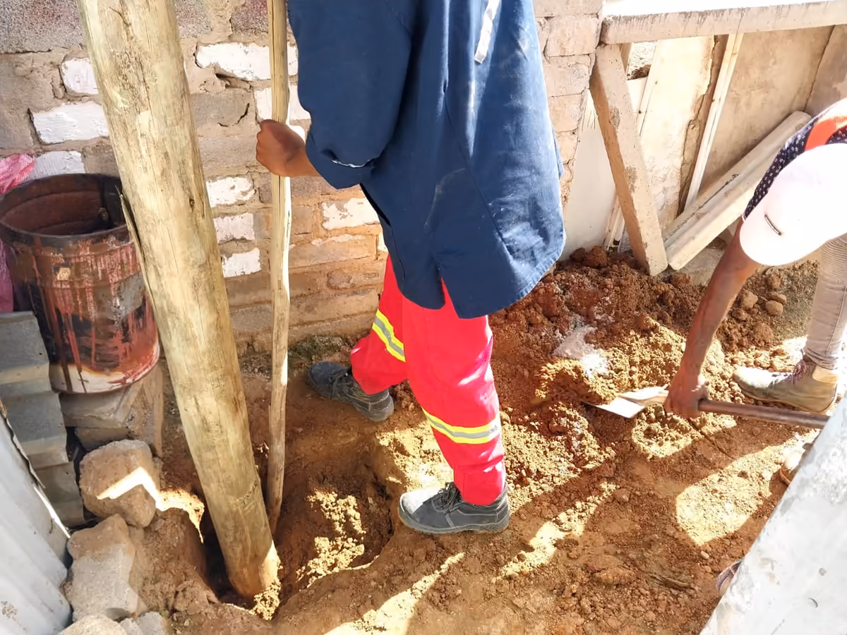 Seldariah Trading team installing telecommunications poles on site